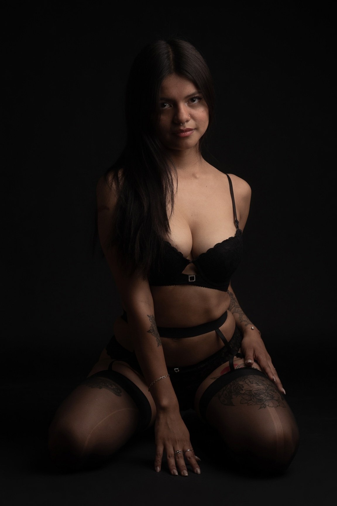 Lia Hancock in a low-key black lingerie portrait